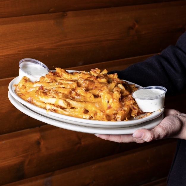 Montana-Mike's-cheese-fries-carried-by-server